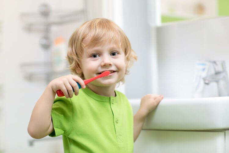 Morgan Street Dental Centre Children's Dentistry - Adorable Child Brushing Teeth in Green Shirt