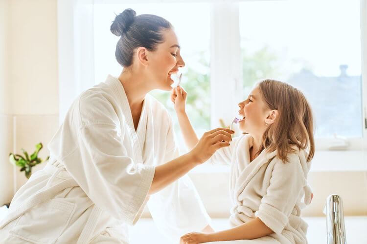 Morgan Street Dental Centre Preventive Care and Dental Hygiene - Mother and Daughter Brushing each other